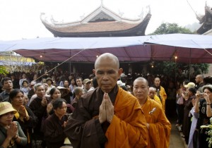 Buddhist monk Nhat Hanh walks among believers at a requiem mass at the Non Nuoc pagoda outside Hanoi