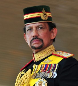 Brunei's Sultan Hassanal Bolkiah stands during his 64th birthday celebrations in Bandar Seri Begawan